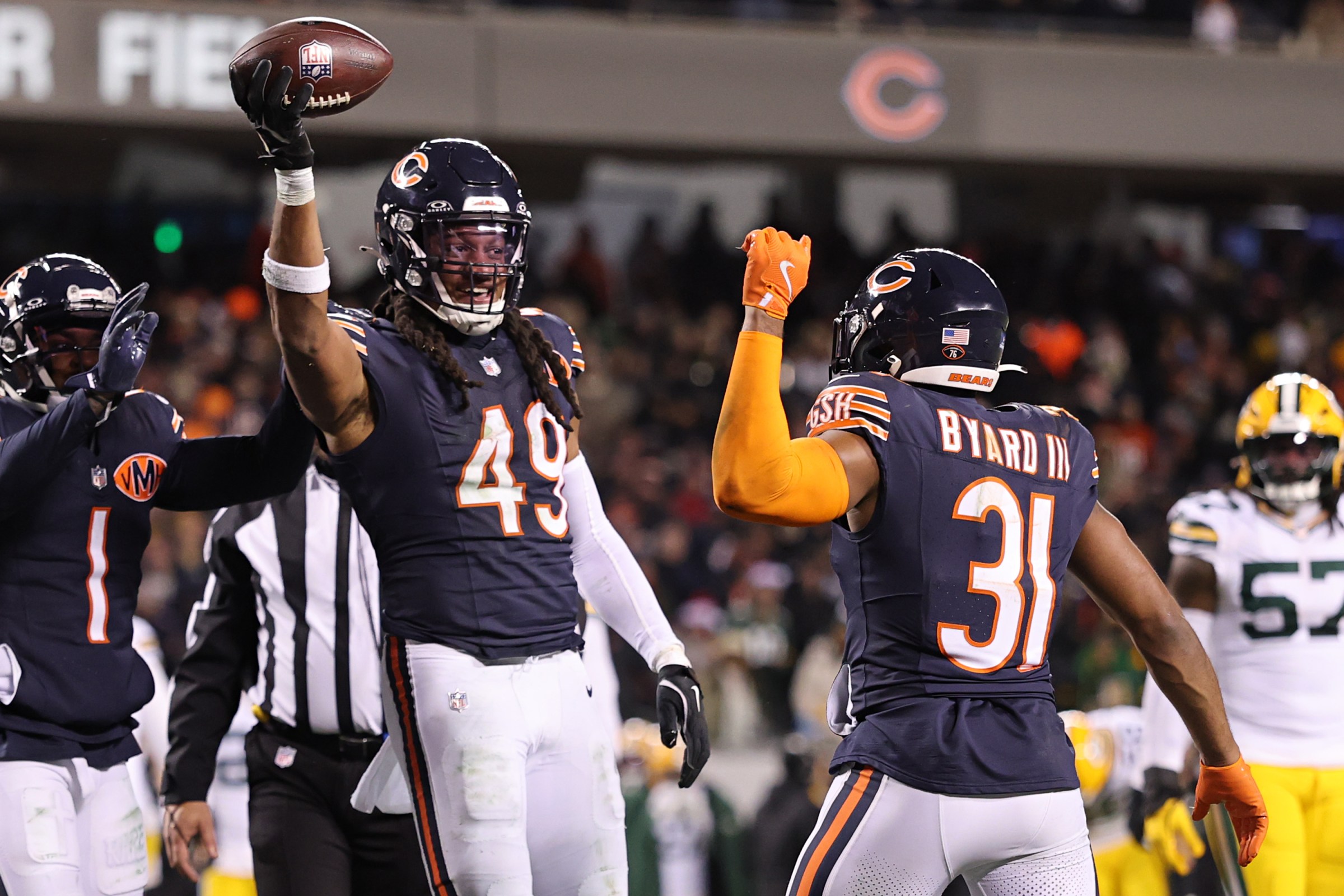 CHICAGO, ILLINOIS - DECEMBER 20: Tremaine Edmunds #49 of the Chicago Bears celebrates with Kevin Byard III #31 after his fumble recovery against the Green Bay Packers during the third quarter at Soldier Field on December 20, 2025 in Chicago, Illinois. (Photo by Michael Reaves/Getty Images)