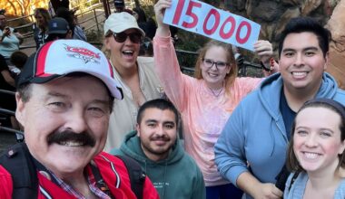 In this photo provided by Jon Alan Hale, Hale, left, poses with friends after taking his 15,000th Radiator Springs Racers ride at Disney California Adventure in Anaheim, Calif., on Monday. (Jon Alan Hale via AP)