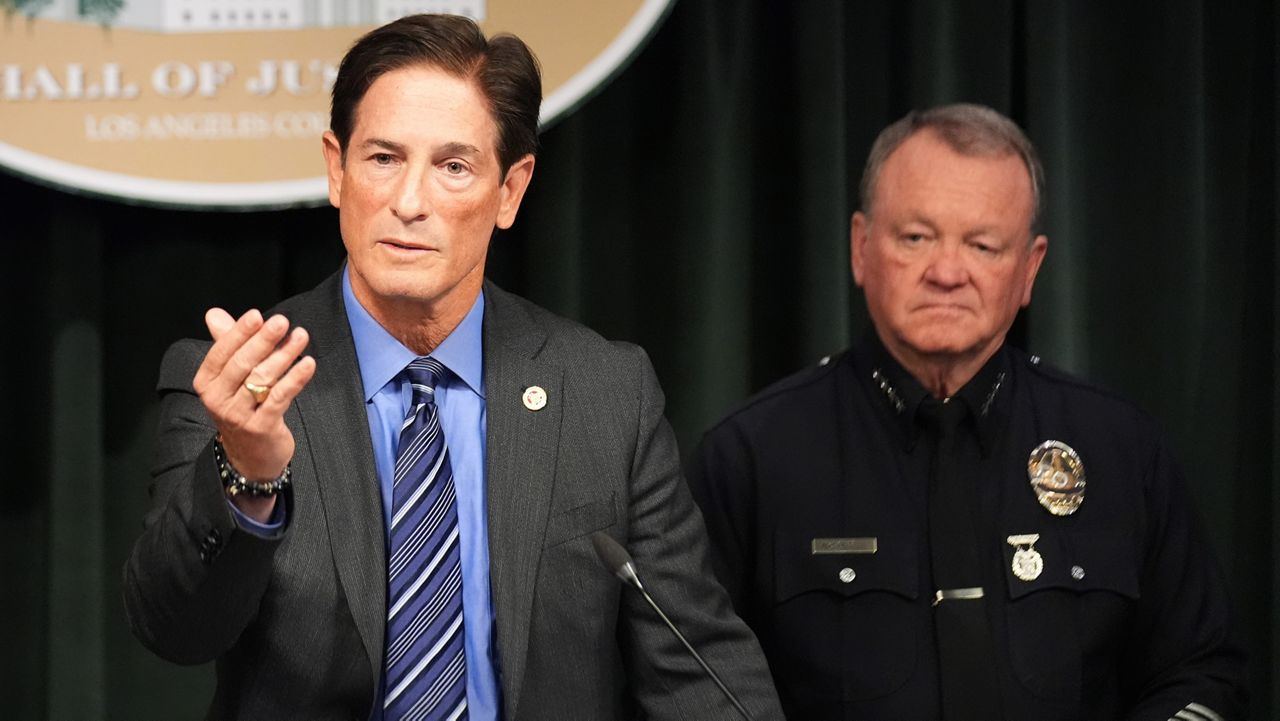 Los Angeles District Attorney Nathan Hochman, left, and LAPD Chief Jim McDonnell announce developments about the murder case of Rob Reiner and his wife Michele on Tuesday, Dec. 16, 2025, in Los Angeles. (AP Photo/Damian Dovarganes)