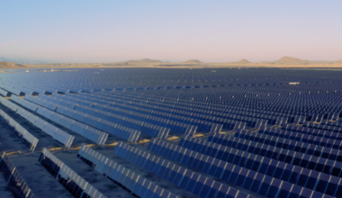 Rows of solar panels stretching to the horizon line