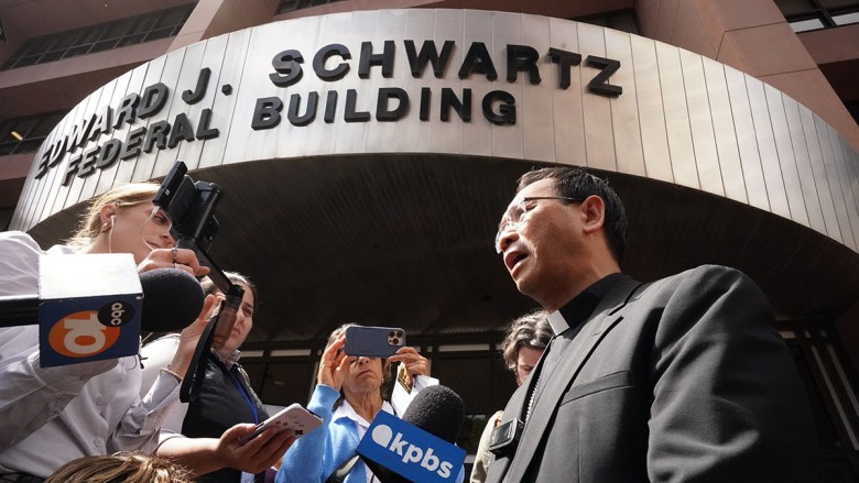 San Diego Bishop Designate Michael Pham tells media about his visit to immigration court. (Photo by Chris Stone/Times of San Diego)