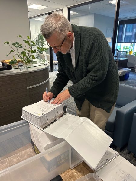 Keene Simonds, executive officer of the San Diego Local Agency Formation Commission, or LAFCO, signs the Association for the City of La Jolla's cityhood application, officially confirming receipt, on Jan. 29. (Association for the City of La Jolla)