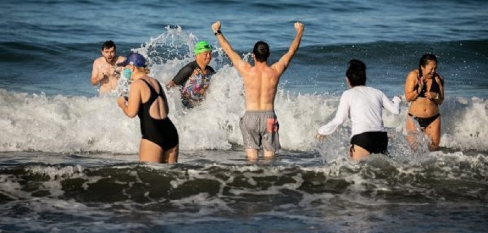 Swimmers participate in a past New Year’s Day Polar Bear...