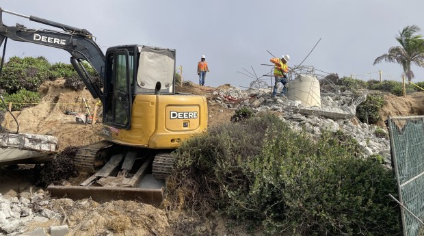 Rubble and twisted steel were all that remained Monday of this stairway being replaced just north of Tamarack Avenue at the beach in Carlsbad.