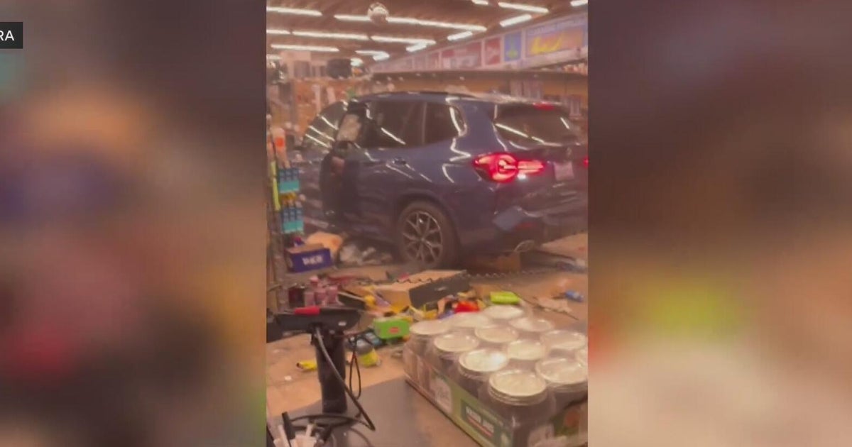 Vehicle crashes into Redwood City hardware store, catches fire