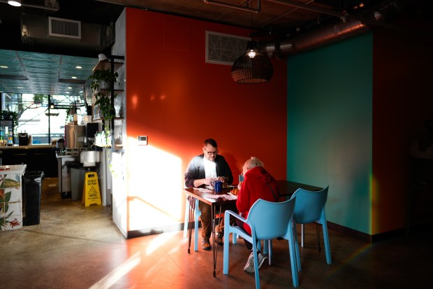 Eric Gollmyer had a latte to go along with breakfast with his mother, Sharon Gollmyer, at Talitha Coffee Roasters on Thursday morning, Dec. 18, 2025, in San Diego, CA. (Nelvin C. Cepeda / The San Diego Union-Tribune)