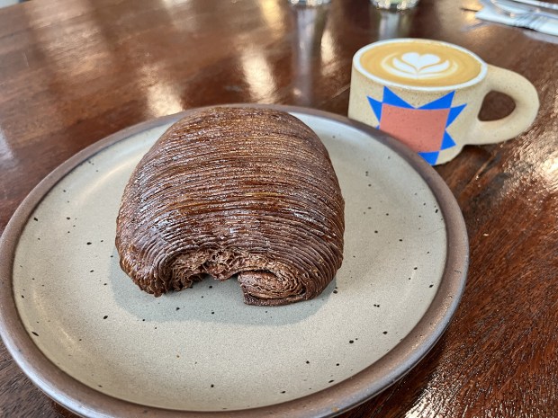 A double pain au chocolat croissant and cappucino at Relic Bakery & Kitchen on Sunday, Oct. 26. (Pam Kragen - The San Diego Union-Tribune)