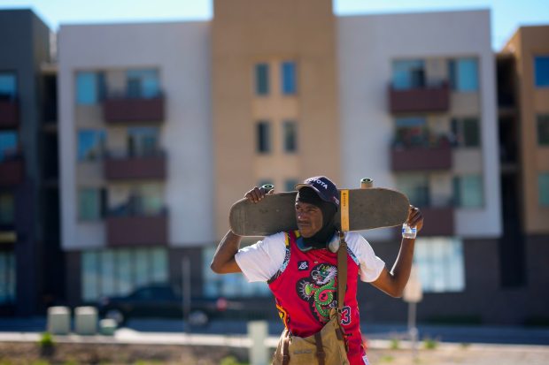 Lemon Grove, CA - November 06: On Thursday, Nov. 6, 2025, at a vacant dirt lot in Lemon Grove, Dalen Harrison, 30, rode his skateboard to follow up on the status of his transitional housing with a local outreach worker, Lawanda Sullivan, from Crisis House, who has been assisting him.    (Nelvin C. Cepeda / The San Diego Union-Tribune)