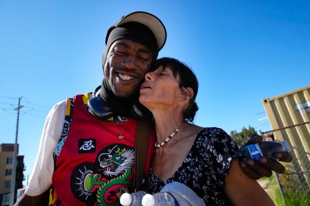Lemon Grove, CA - November 06: On Thursday, Nov. 6, 2025, at a vacant dirt lot in Lemon Grove, Dalen Harrison, 30, said goodbye to Danielle Reese, 50.  After living on the streets off and on for the past 15 years, Reese is transitioning to permanent housing.  Harrison was at the lot to follow up on the status of his transitional housing with a local outreach worker, Lawanda Sullivan, from Crisis House, who has been assisting him.   (Nelvin C. Cepeda / The San Diego Union-Tribune)