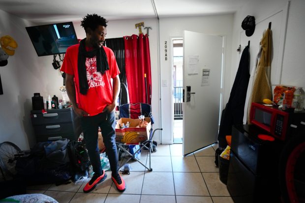 On Tuesday, Dec. 16, 2025, 6'10" Dalen Harrison, 30, was sleeping in a tent in November with his feet sticking out because he was taller than his tent. Dalen is currently living in a single-room apartment in Spring Valley. He is transitioning from his previous experiences living in various encampments in Lemon Grove to a more stable transitional apartment.
