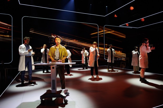 Wren Rivera as organ donation coordinator Marthe, foreground, with the cast of La Jolla Playhouse's world-premiere musical "The Heart." (Rich Soublet II)