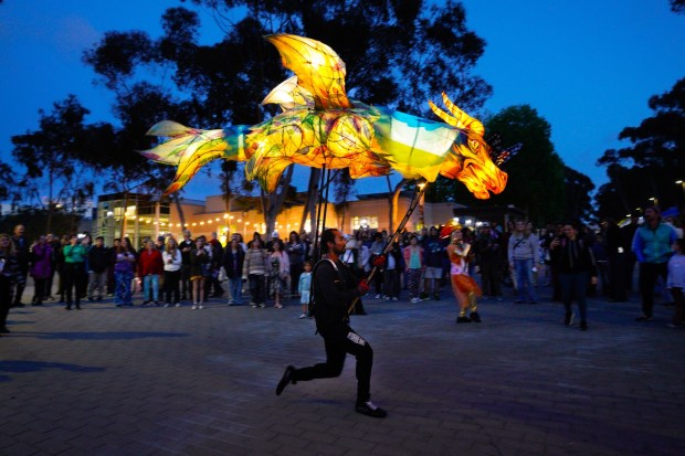 One of the performers with the ODDISEA: A Puppet Procession entertains the crowd at the WOW festival with the rhythms of the Chunky Hustle Brass Band playing at UC San Diego on Thursday, April 24, 2025, in San Diego, CA. (Nelvin C. Cepeda / The San Diego Union-Tribune)