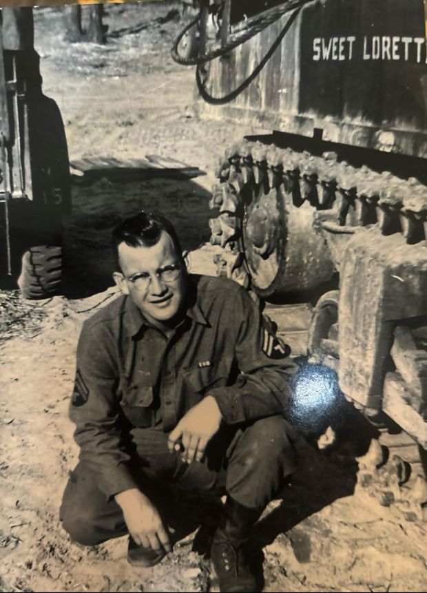 Robert Stammen, Craig Stammen's grandfather, poses next to the tank he named after his future wife during World War II.
