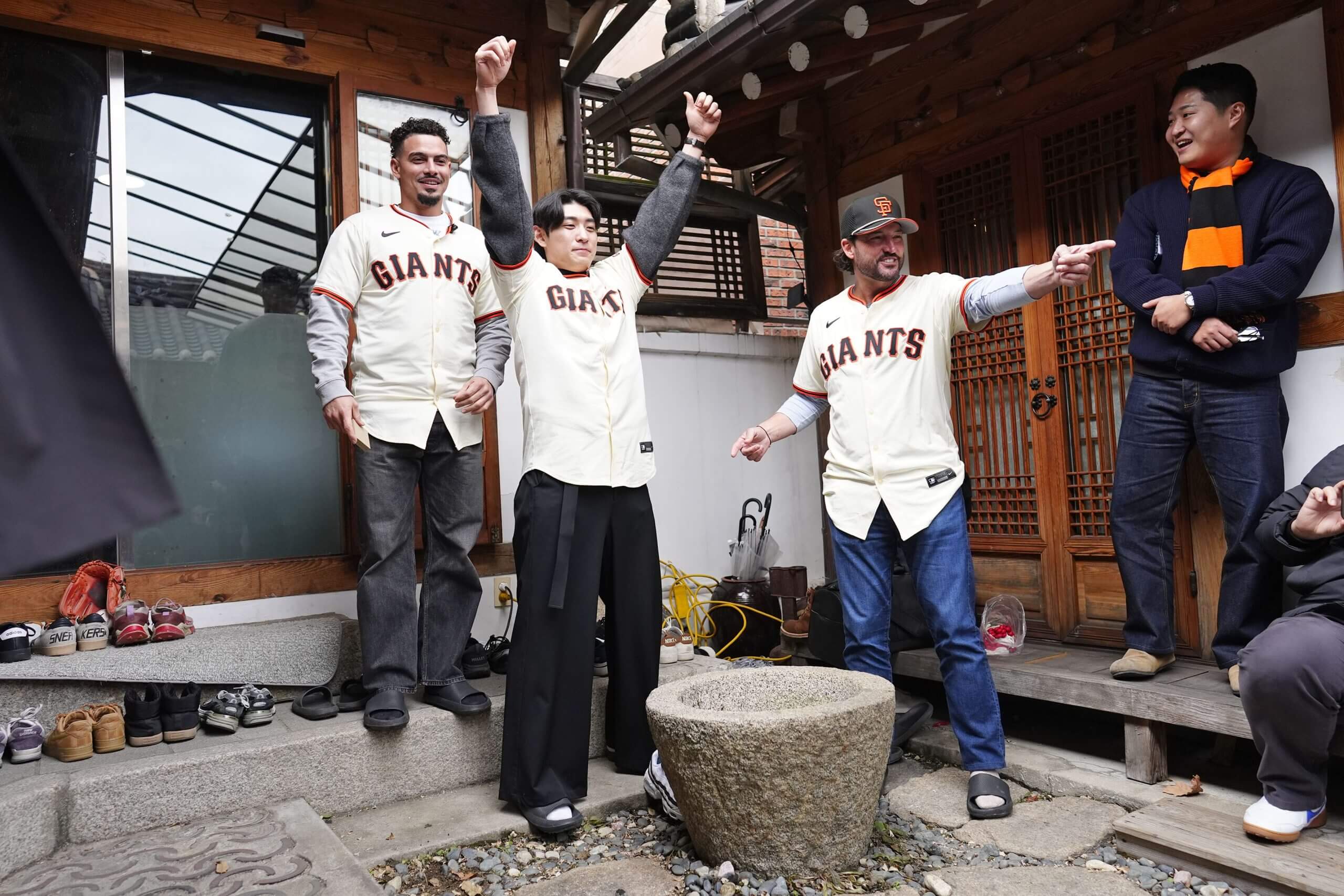 Willy Adames, Jung Hoo Lee and manager Tony Vitello play a local Korean game in Bukchon Hanok Village in Seoul, South Korea.