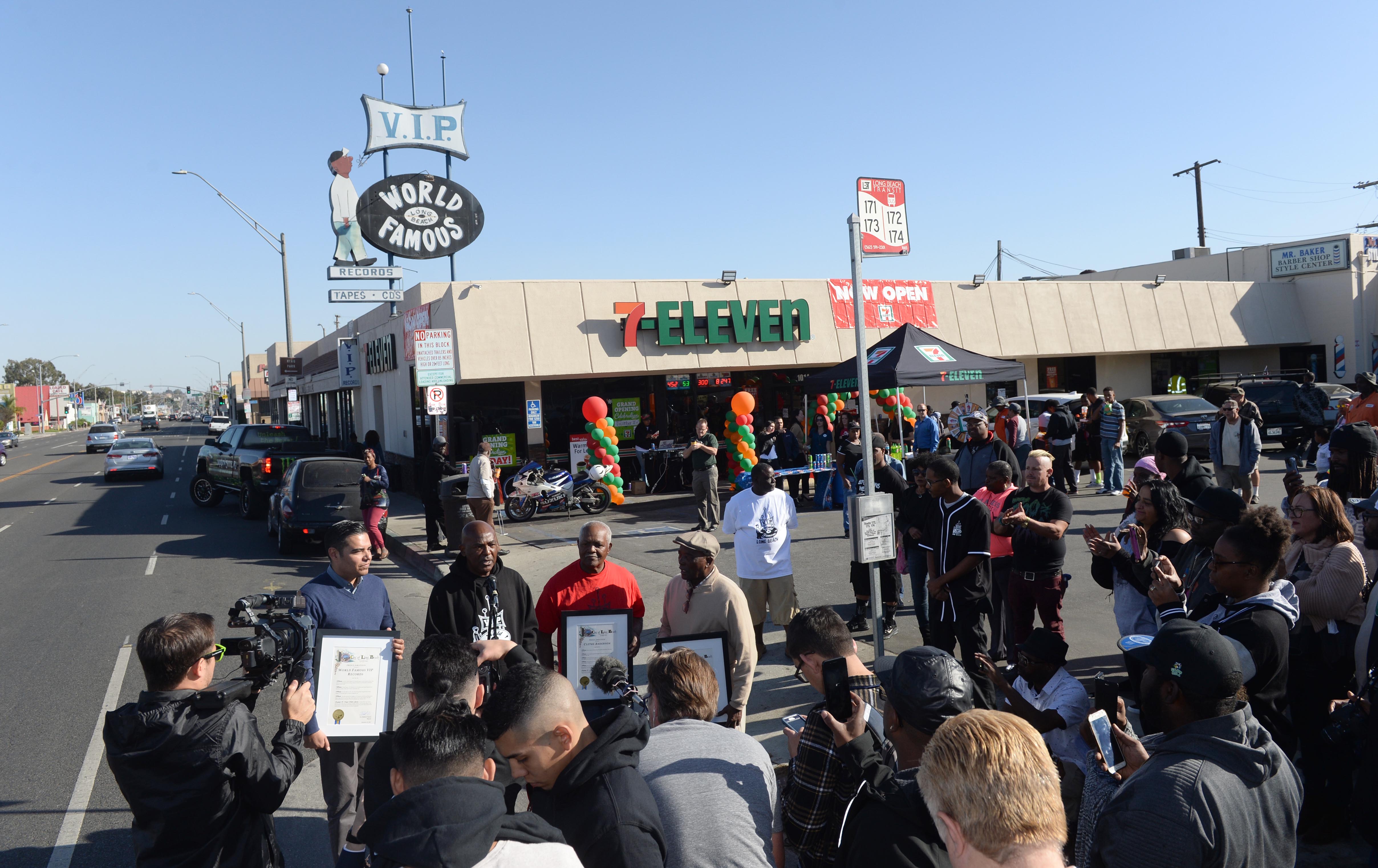 From left to right, Mayor Robert Garcia, VIP records owner...