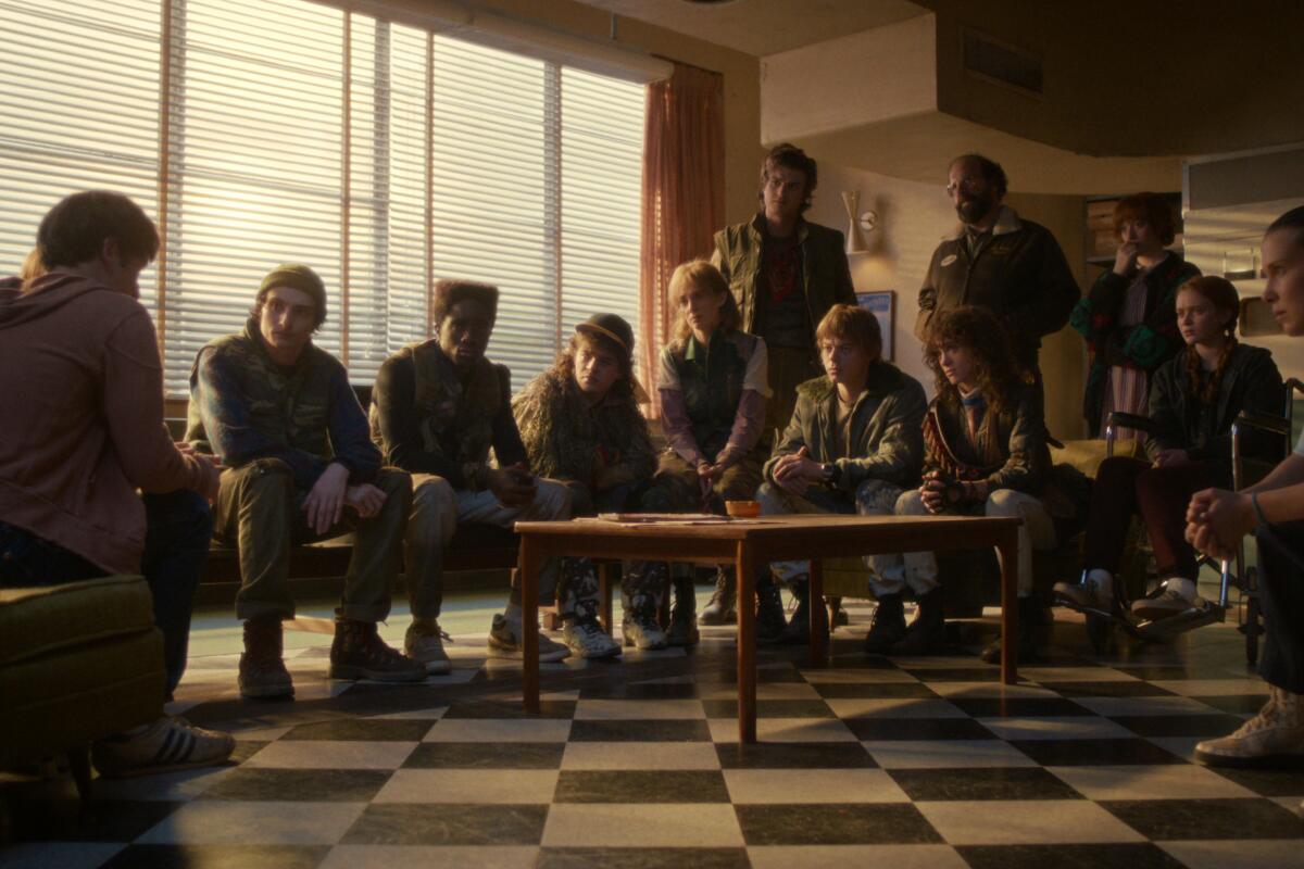 A group of people sit around a table