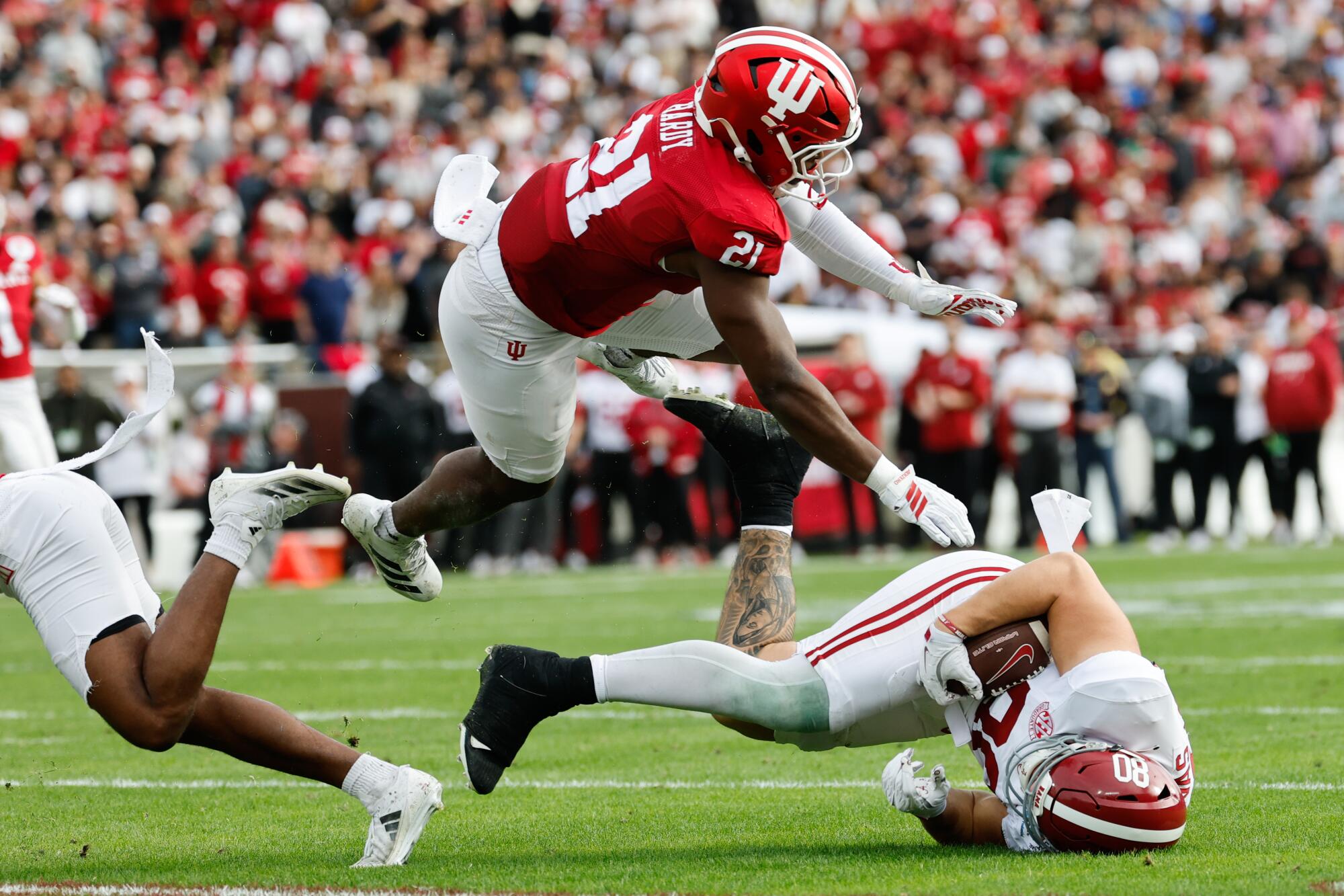 Indiana linebacker Rolijah Hardy tackles Alabama tight end Josh Cuevas after a reception in the second quarter.
