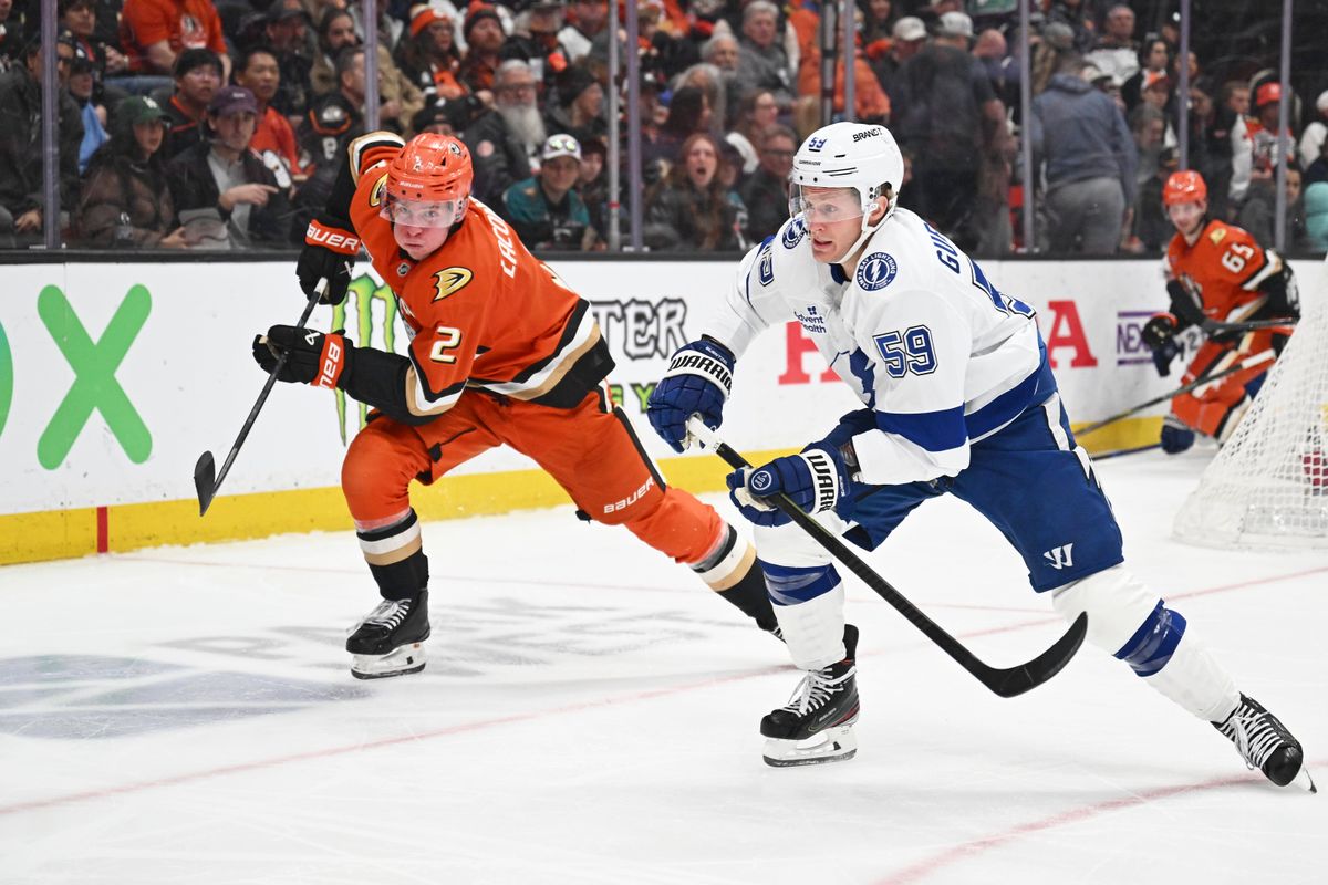 Anaheim Ducks defender Jackson LaCombe (2) rushes for the puck against the Lightning at the Honda Center on December 31,2025 in Anaheim, California.