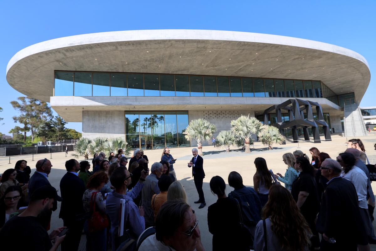 LACMA director Michael Govan leads a media tour outside the new David Geffen Galleries building.