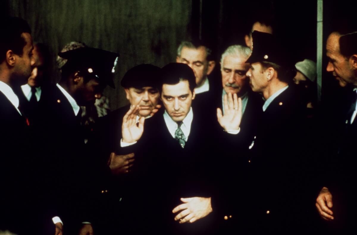 A crime lord testifies in a courtroom.