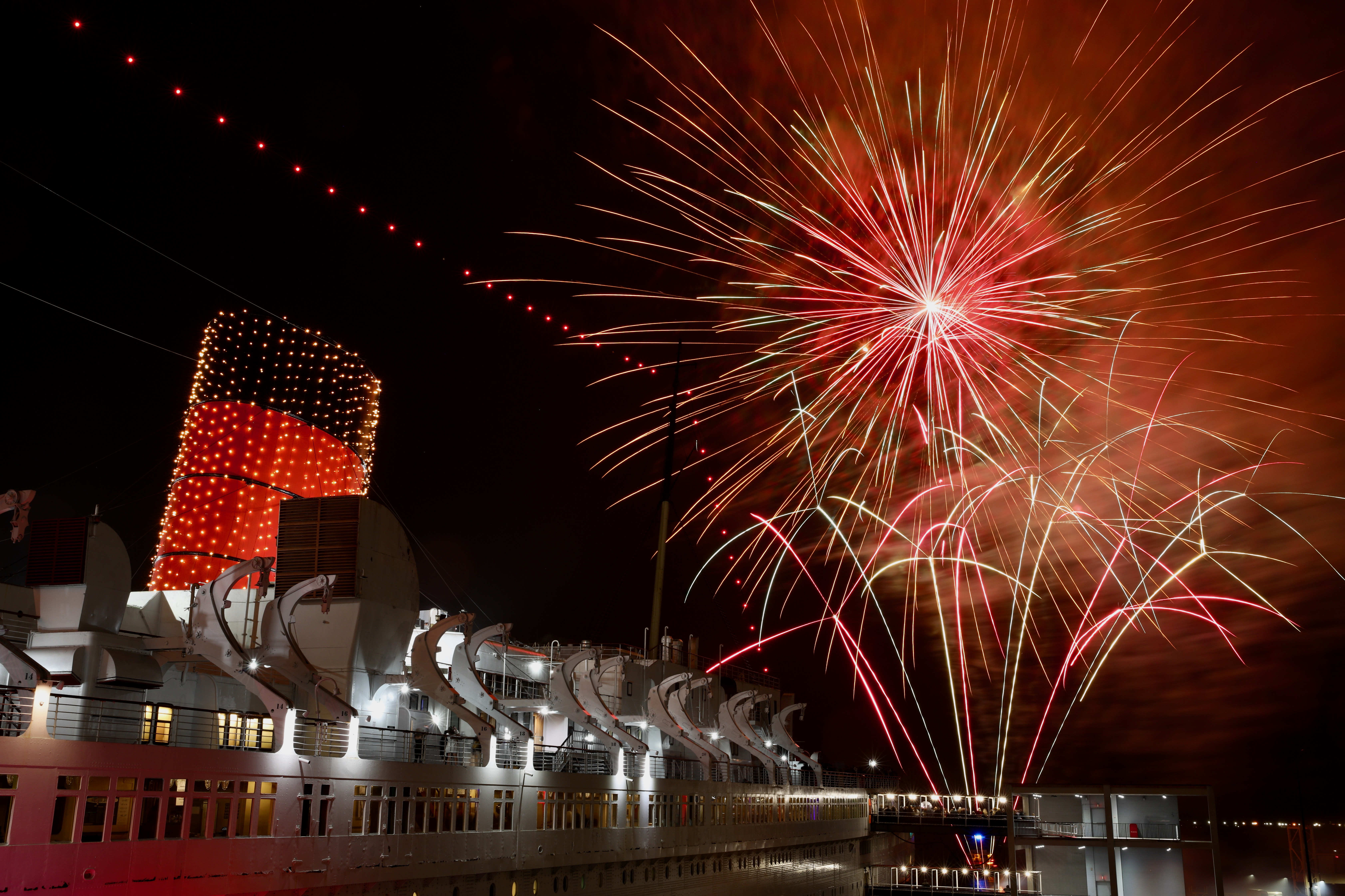 A midnight fireworks show at the Queen Mary rings in...