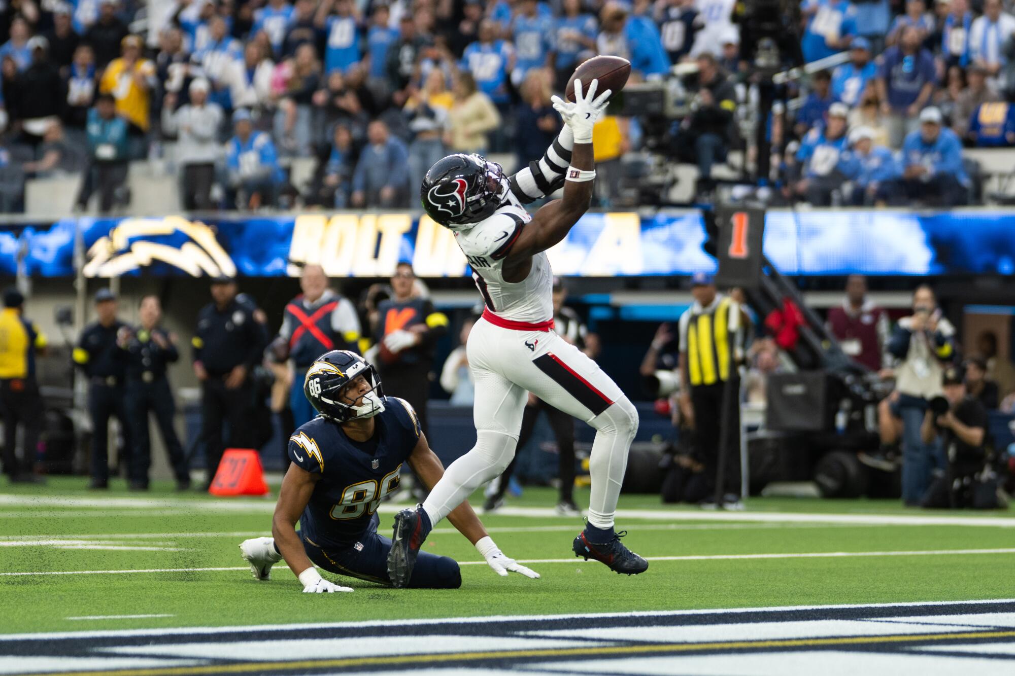 Texans linebacker Azeez al-Shaair intercepts a pass that deflected off the hands of Chargers tight end Oronde Gadsden II.