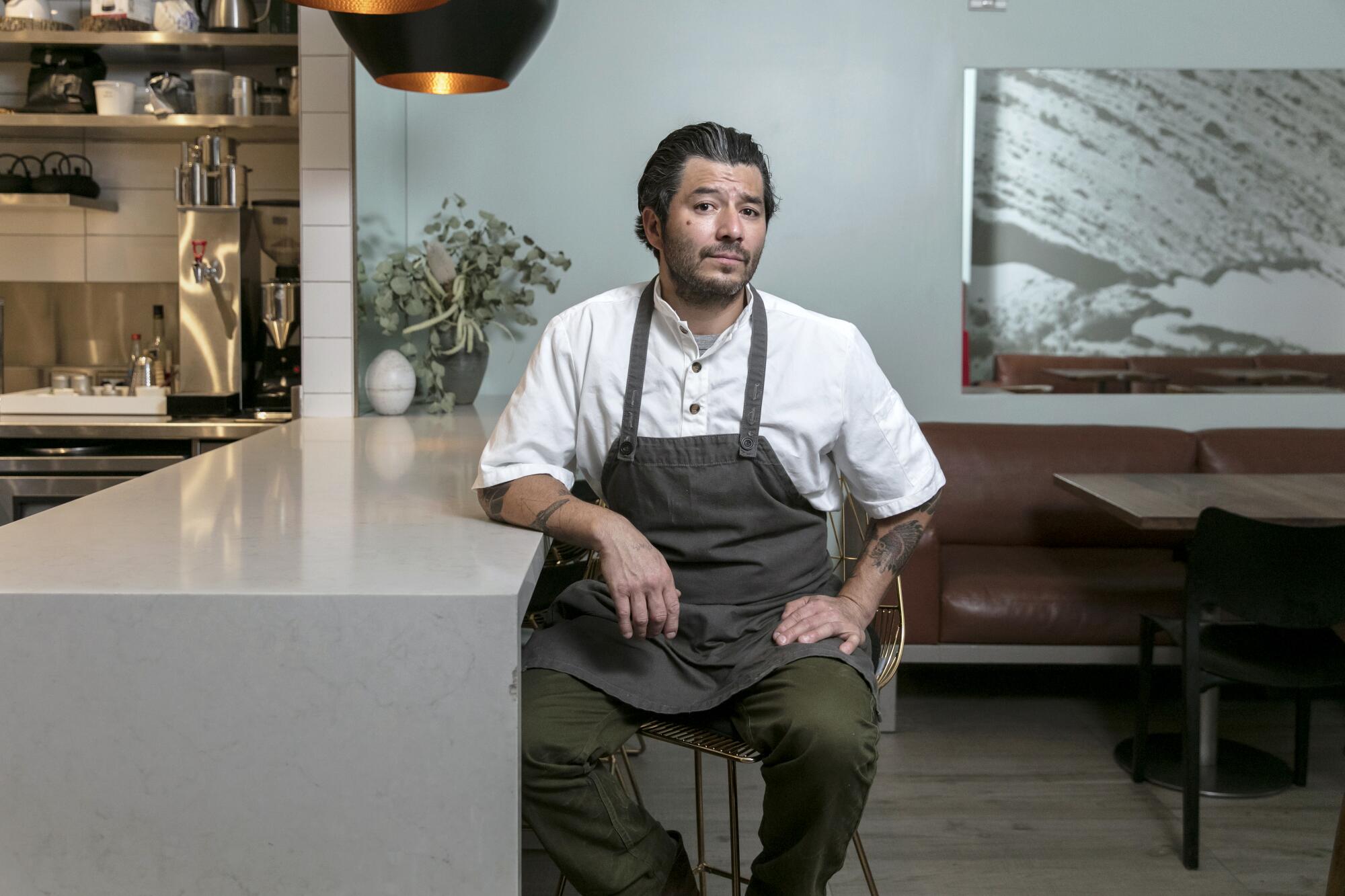 Josef Centeno poses for a photo at his fine dining restaurant Oras & Winston in Downtown L.A. 