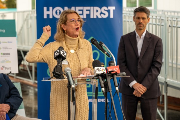 DignityMoves CEO Elizabeth Funk, center, speaks at the grand opening ceremony of San Jose's latest tiny home community on Nov. 17, 2025. The 136-bed community sits on the Santa Clara Valley Water District's property at 5205 Cherry Ave. (Devan Patel/Bay Area News Group)