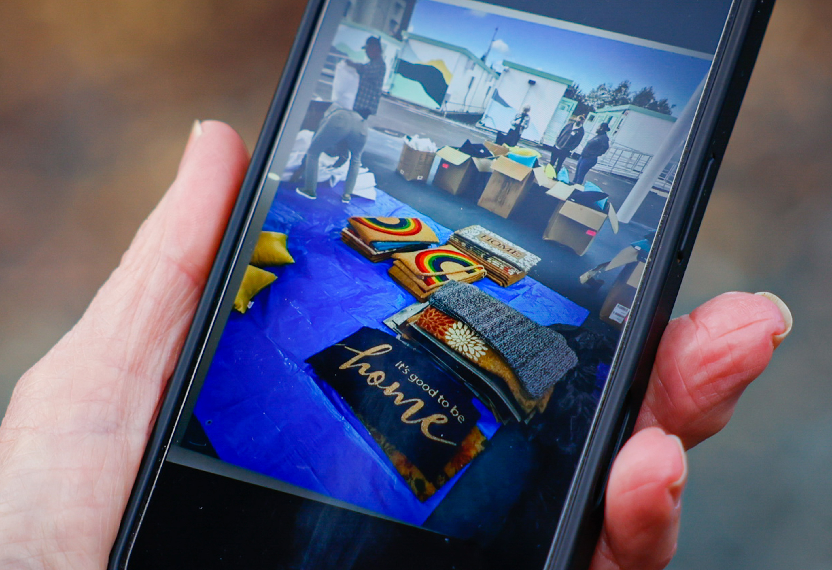 Marsey Kahn shows a picture of items her and other...