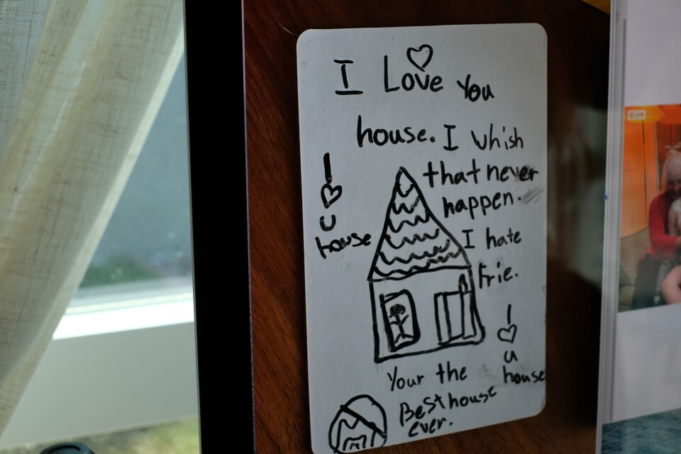 A drawing shows a house and says "I love you house. I wish that never happen."