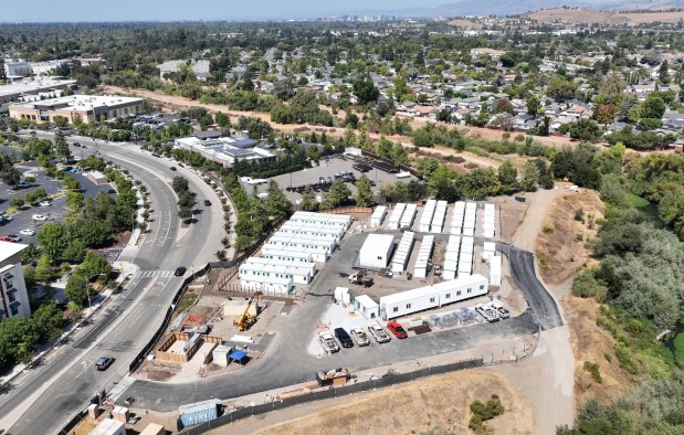 A drone view of the Cherry Avenue Interim Supportive Housing in San Jose, Calif., on Wednesday, Sept. 17, 2025. Downtown San Jose can be seen on the top center. (Nhat V. Meyer/Bay Area News Group)
