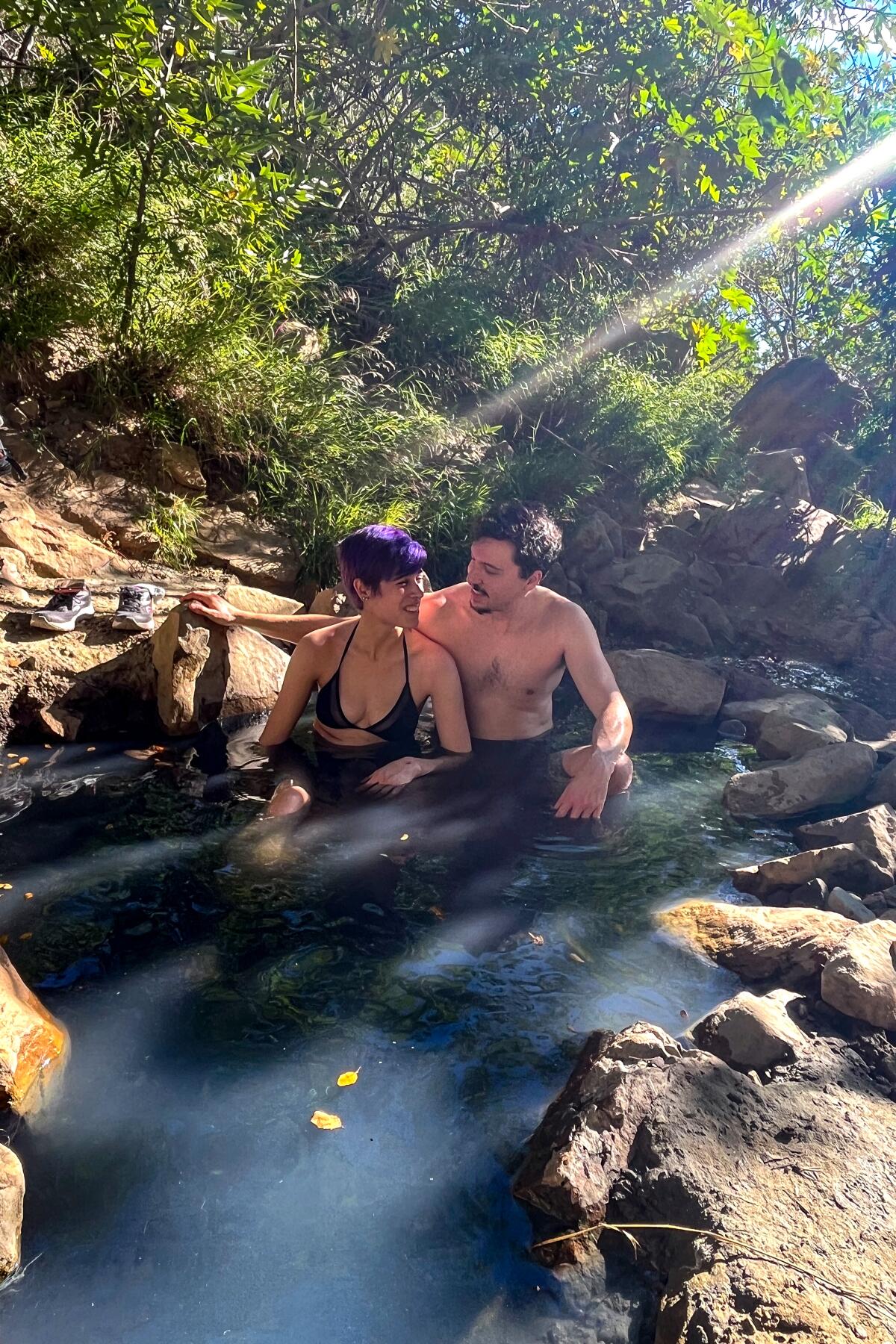 Hikers Ryan Binter and Kyra Rubinstein soak at Montecito Hot Springs.