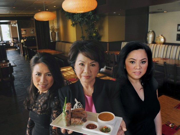 Diane Dang, center, with daughters Chau Haller, left, and Lisa Vo pictured in 2015. The family owns Brodard Restaurant in Orange County and will be expanding to Long Beach sometime in 2026. (Photo by Ana Venegas)