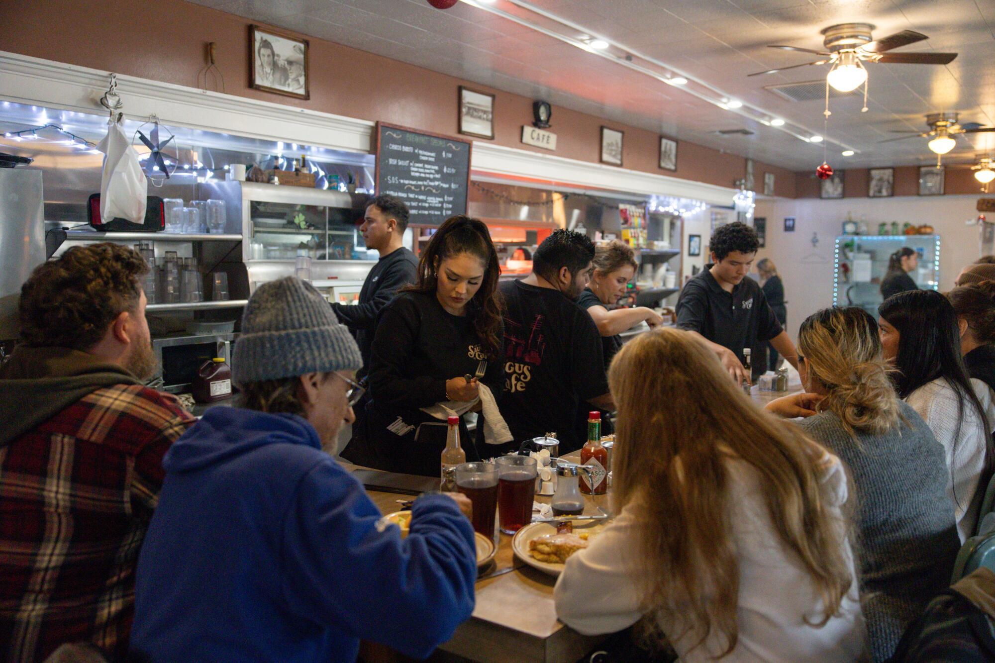 Manager Yecenia Ponce waits on customers at the Original Saugus Cafe.