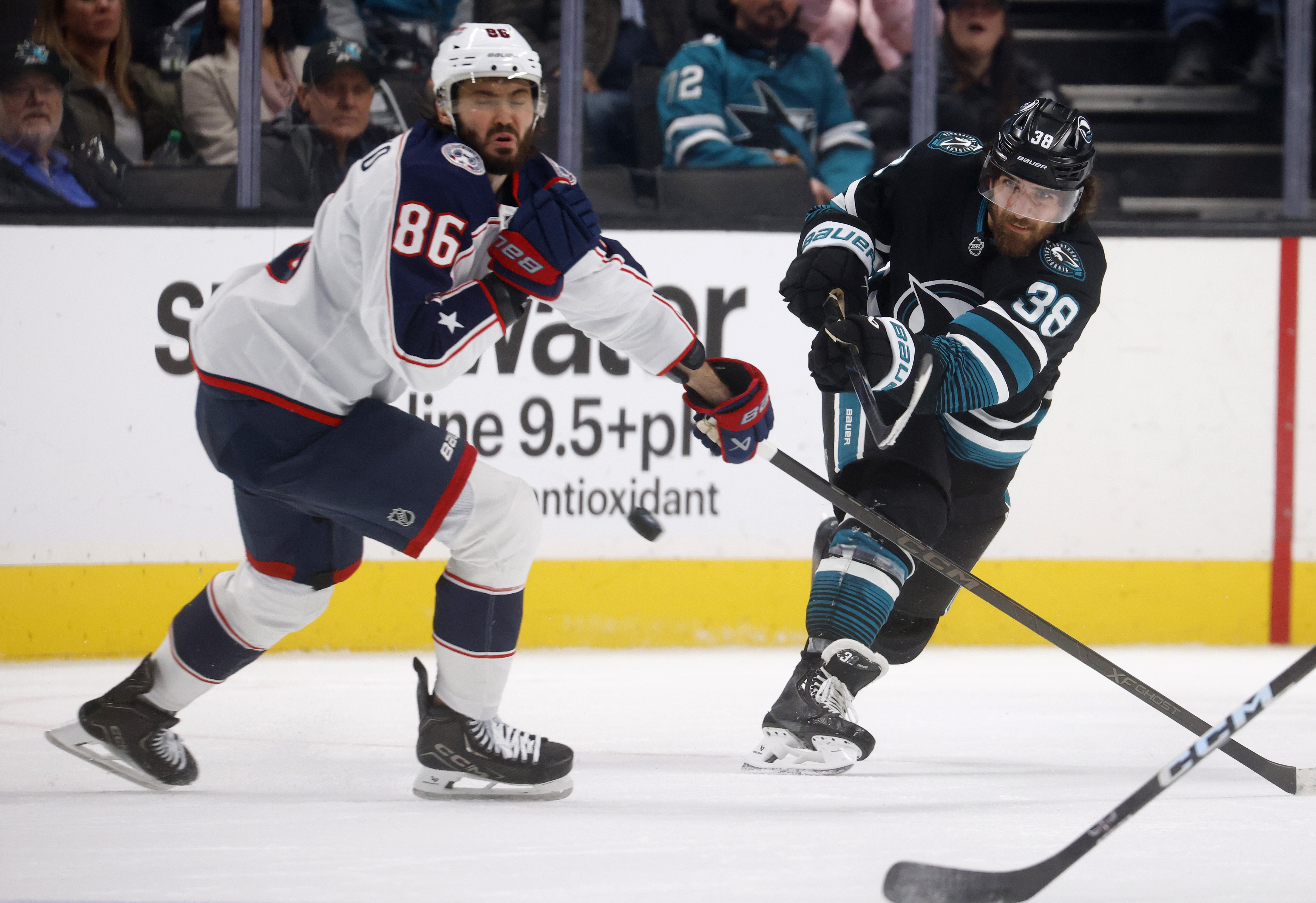 San Jose Sharks’ Mario Ferraro (38) scores and empty net...