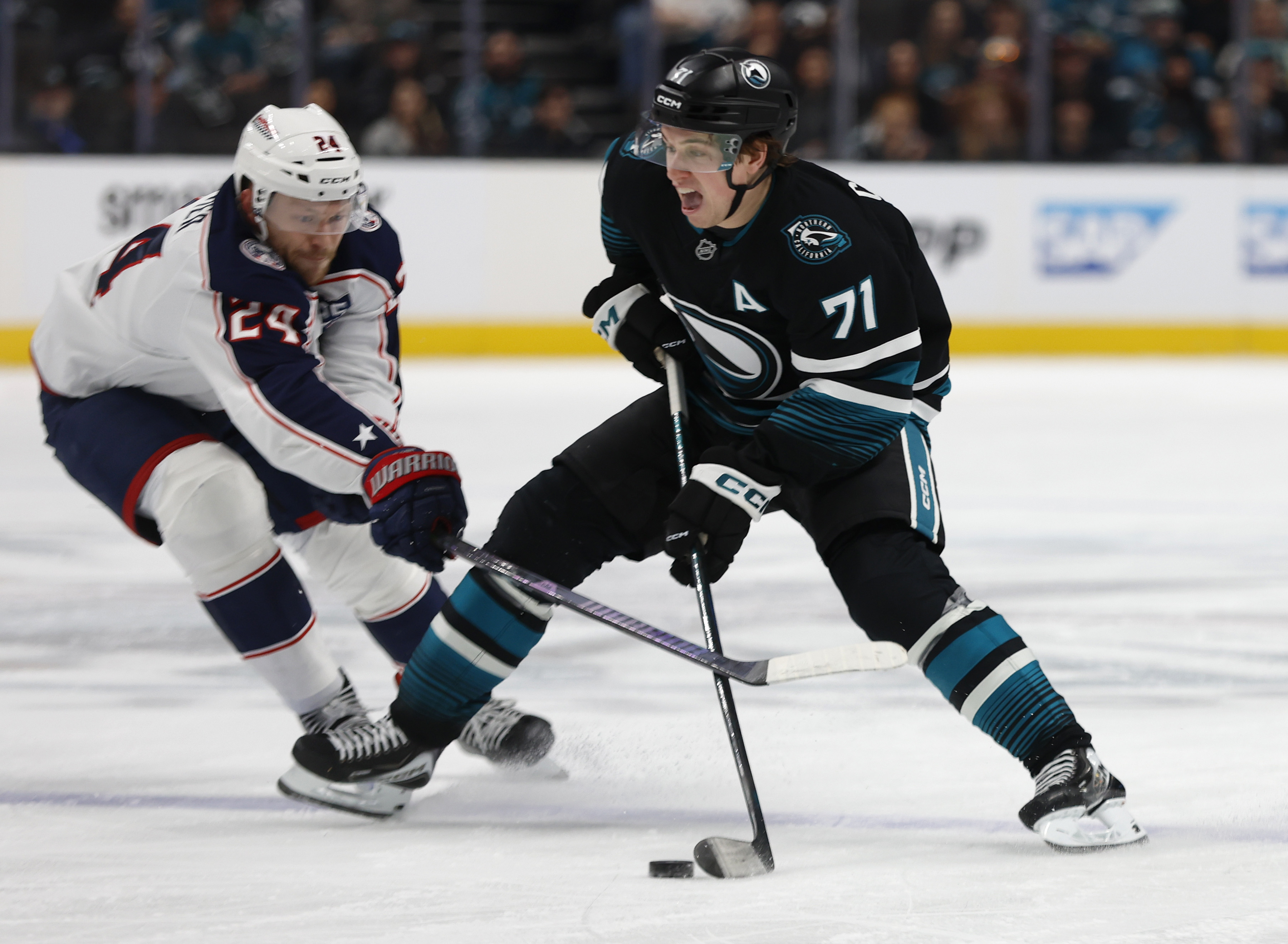 San Jose Sharks’ Macklin Celebrini (71) controls the puck against...