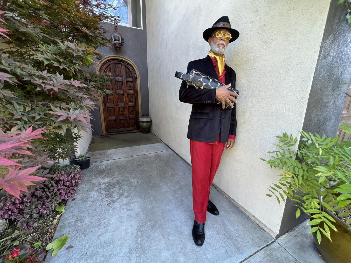 Darryl "JMD" Moore in front of his home that burned down in the wildfires, taken in 2023.