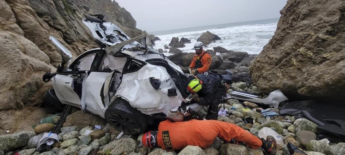 San Mateo County Sheriff's Office emergency personnel respond to a vehicle over the side of Highway 1 on Jan. 1, 2023.