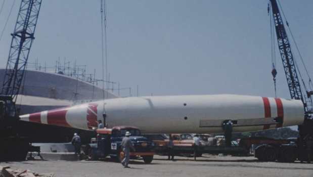 Workmen install the Moonliner rocket in Tomorrowland at Disneyland before the park opened in 1955. (Courtesy of Disney)