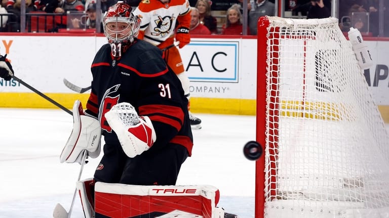 Carolina Hurricanes goaltender Frederik Andersen (31) watches the puck against...