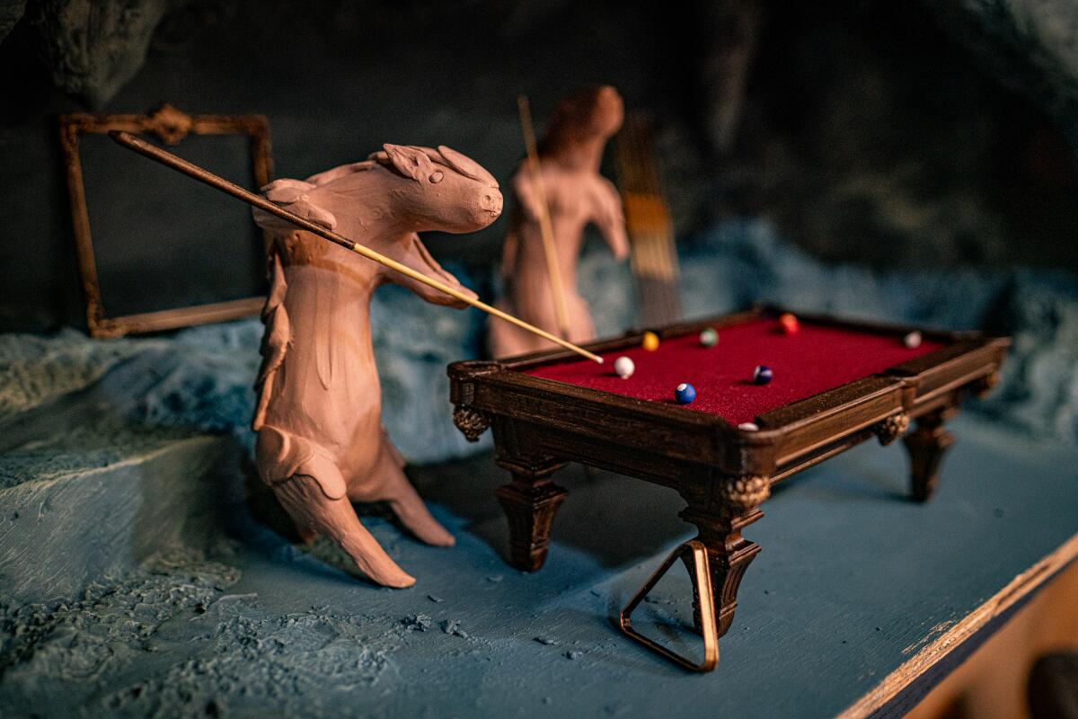 An artwork depicting pigs shooting pool.