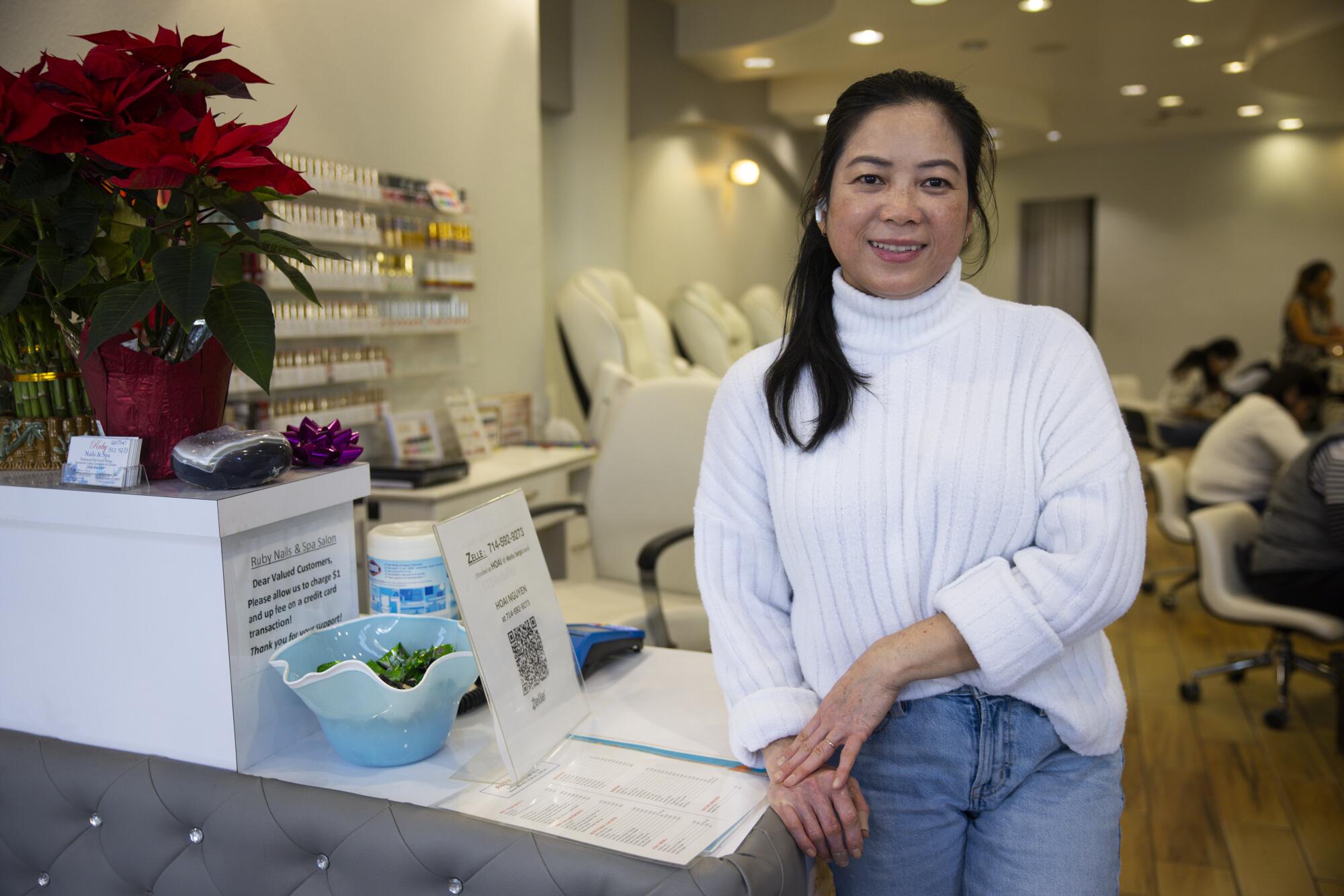Ruby Hong-Tran, owner of Ruby Nails & Spa in Pacific Palisades, says her business is half of what it was since reopening.