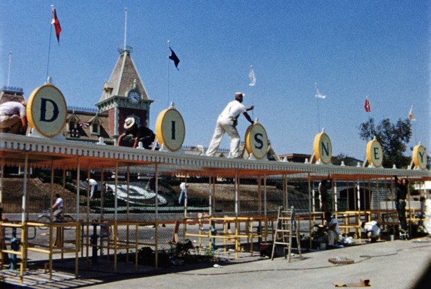 A craftsman works on the main entrance at Disneyland before the park opened in 1955. (Courtesy of Disney)