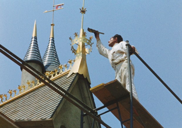 A craftsman works on a Sleeping Beauty Castle turret at Disneyland before the park opened in 1955. (Courtesy of Disney)