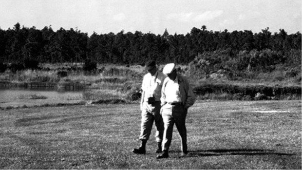 Disney Legend Joe Fowler and Walt Disney conduct the first on-site inspection in November 1965 of the secretive Project X - which would become Florida's Magic Kingdom. (Courtesy of D23)