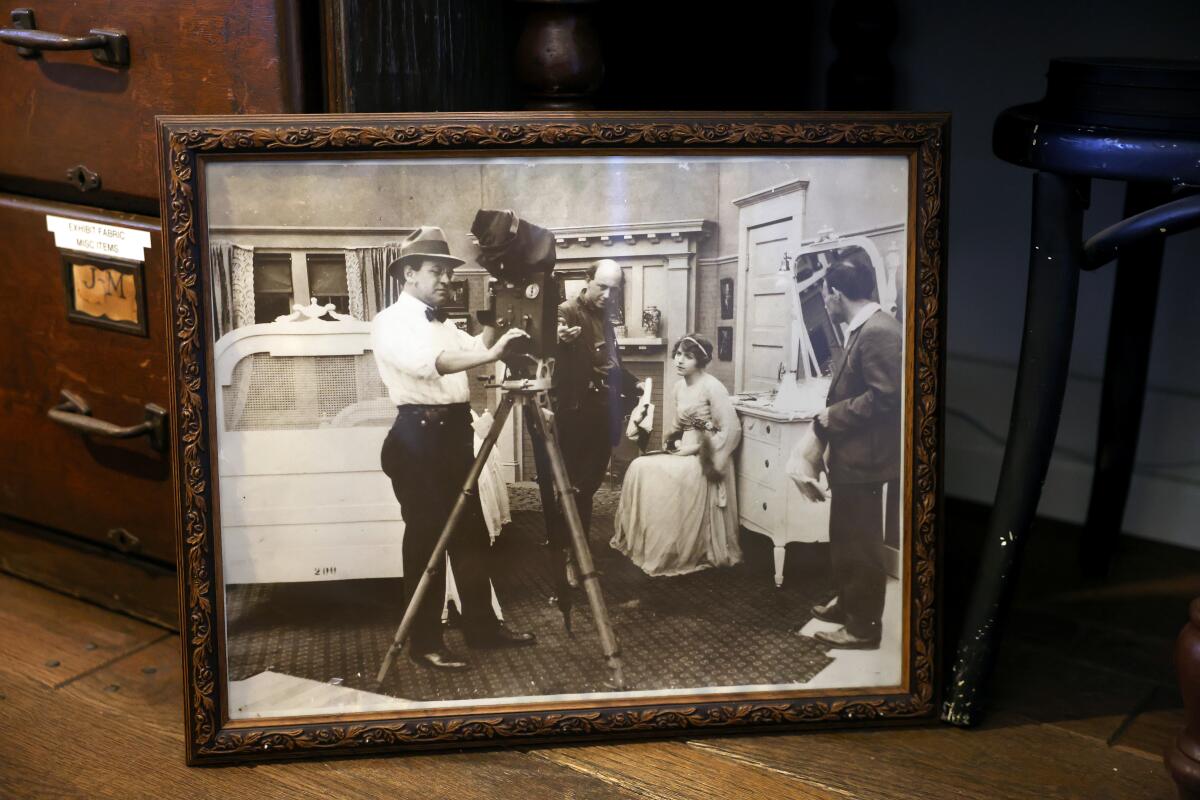 A framed photo of a scene from the 1915 film "The Wild Goose Chase."