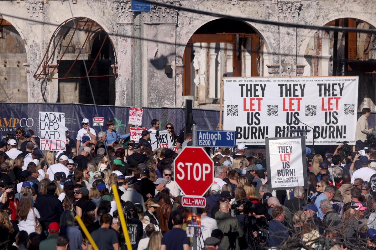 Hundreds of survivors gather in Palisades Village to commemorate the one year anniversary of the Palisades fire 