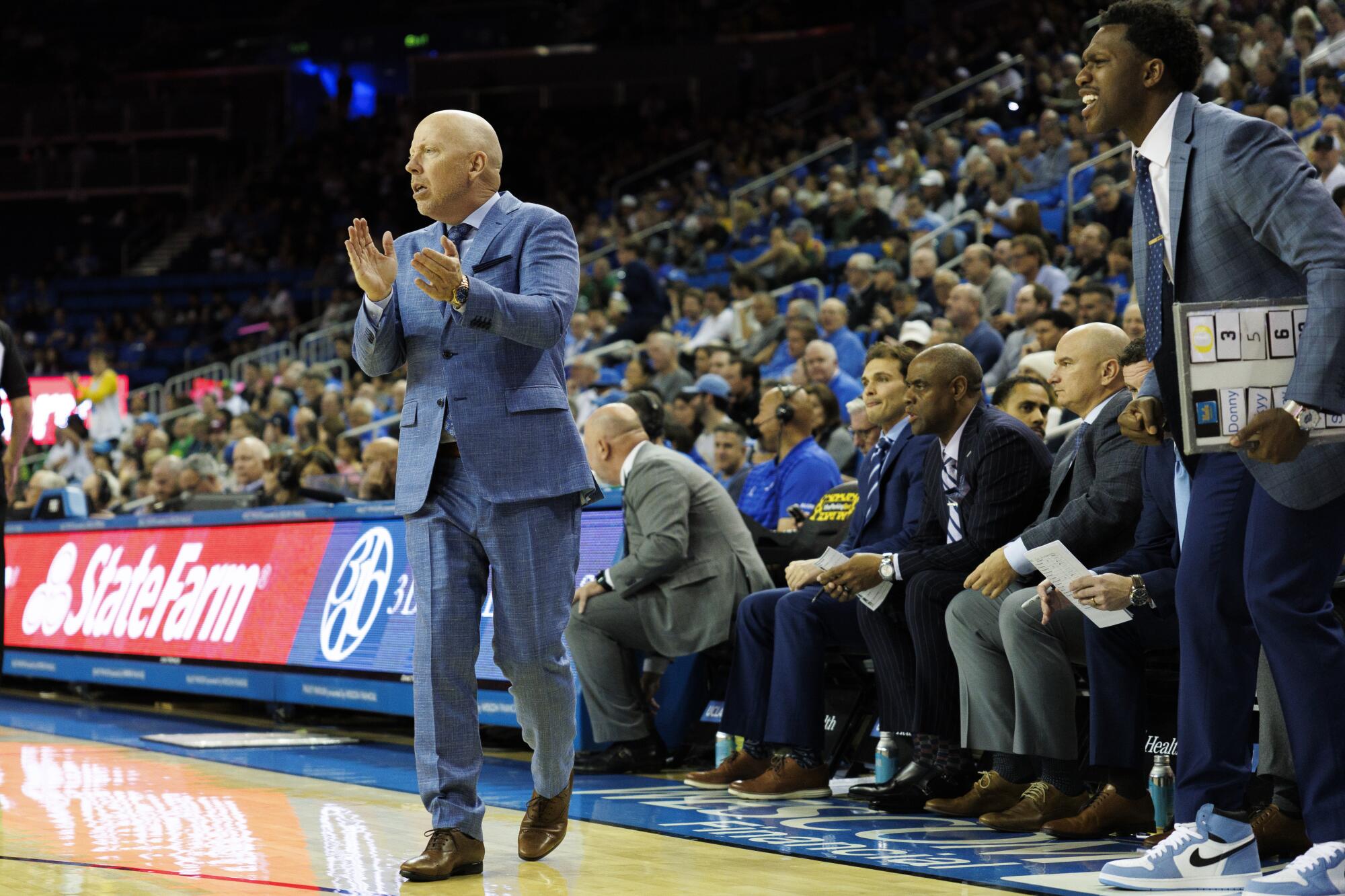 UCLA coach Mick Cronin cheers on his team against Oregon at Pauley Pavilion on Dec. 6.