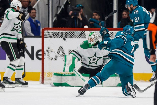 The San Jose Sharks' Tyler Toffoli (73) scores the game winning goal against Dallas Stars' Casey DeSmith (1) during overtime at SAP Center in San Jose, Calif., on Saturday, Jan. 10, 2026. (Shae Hammond/Bay Area News Group)