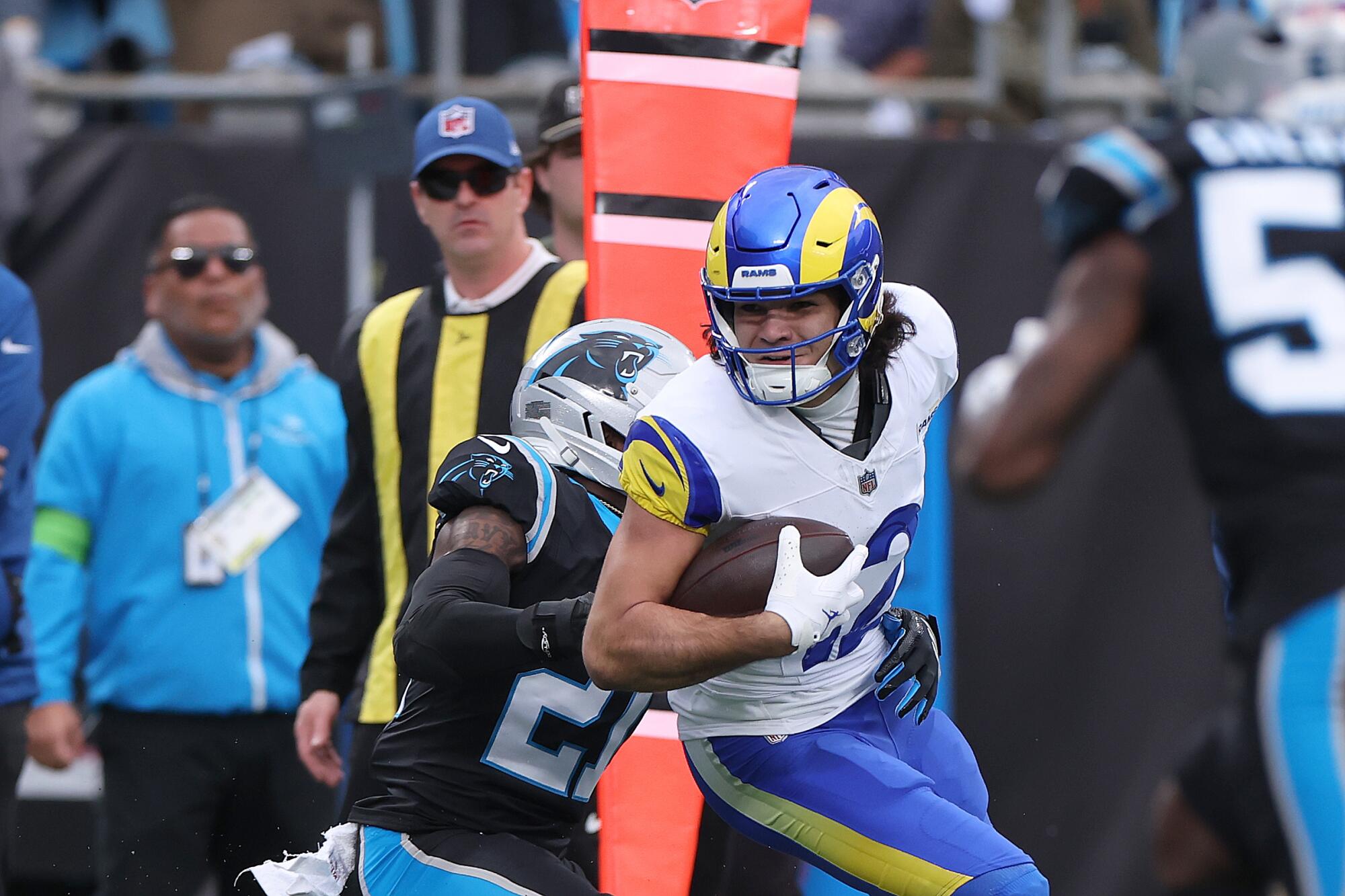 Rams wide receiver Puka Nacua carries the ball in the first quarter against the Carolina Panthers.